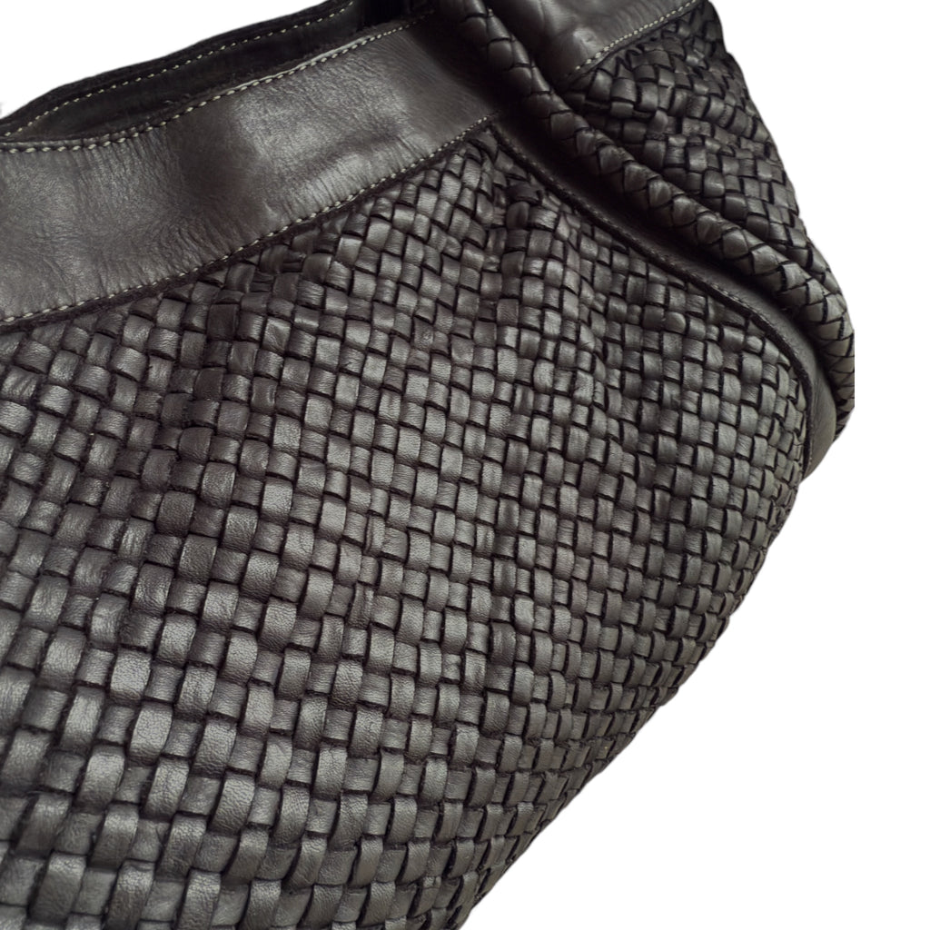Close up showing hand woven black Italian leather handbag made in Italy 
