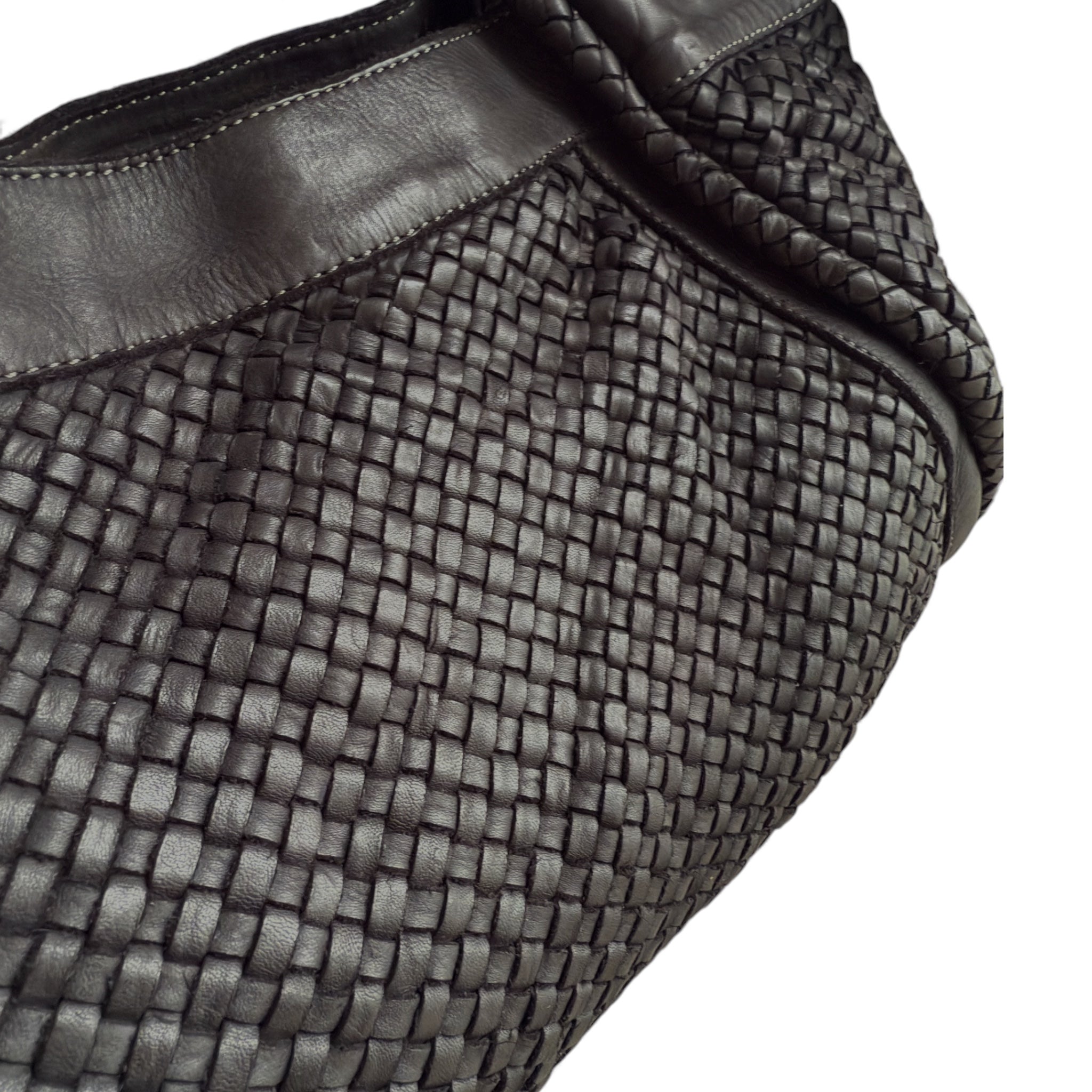 Close up showing hand woven black Italian leather handbag made in Italy 