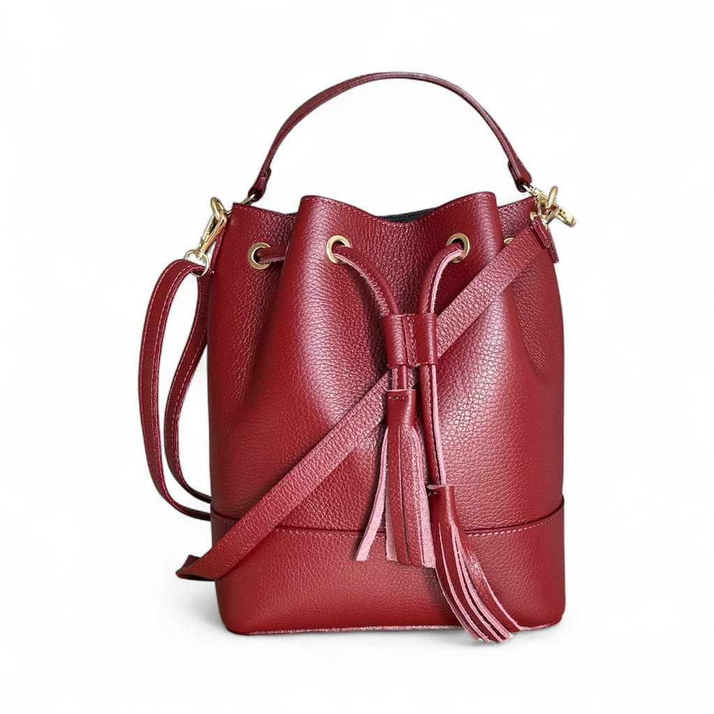 Italian leather bucket handbag 
Colour Wine 
Removable shoulder strap
Imported from Florence Italy 
Sussex Kent Surrey Independent handbag retailer 
