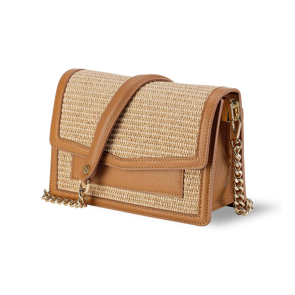 Tan Italian leather and raffia handbag 
Removable shoulder strap 
Inside zipped central compartment 
Made in Italy 
Sussex Kent Surrey Independent handbag retailer 