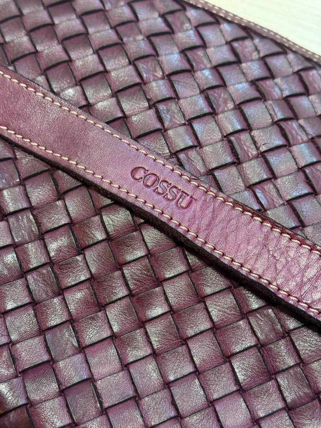 Close up of logo Cossu handwoven 