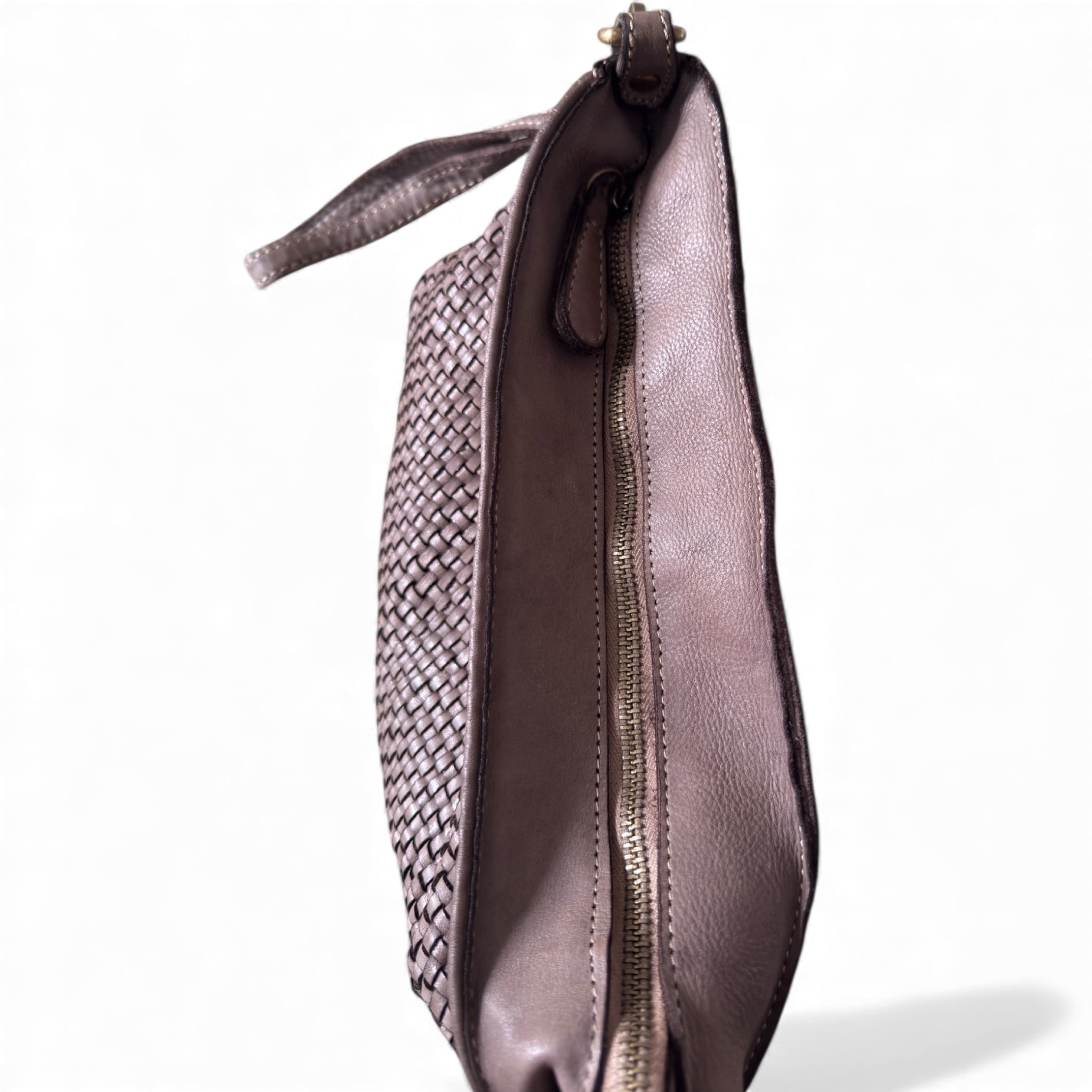 Showing the top of the handwoven pouch with a zipped closure 