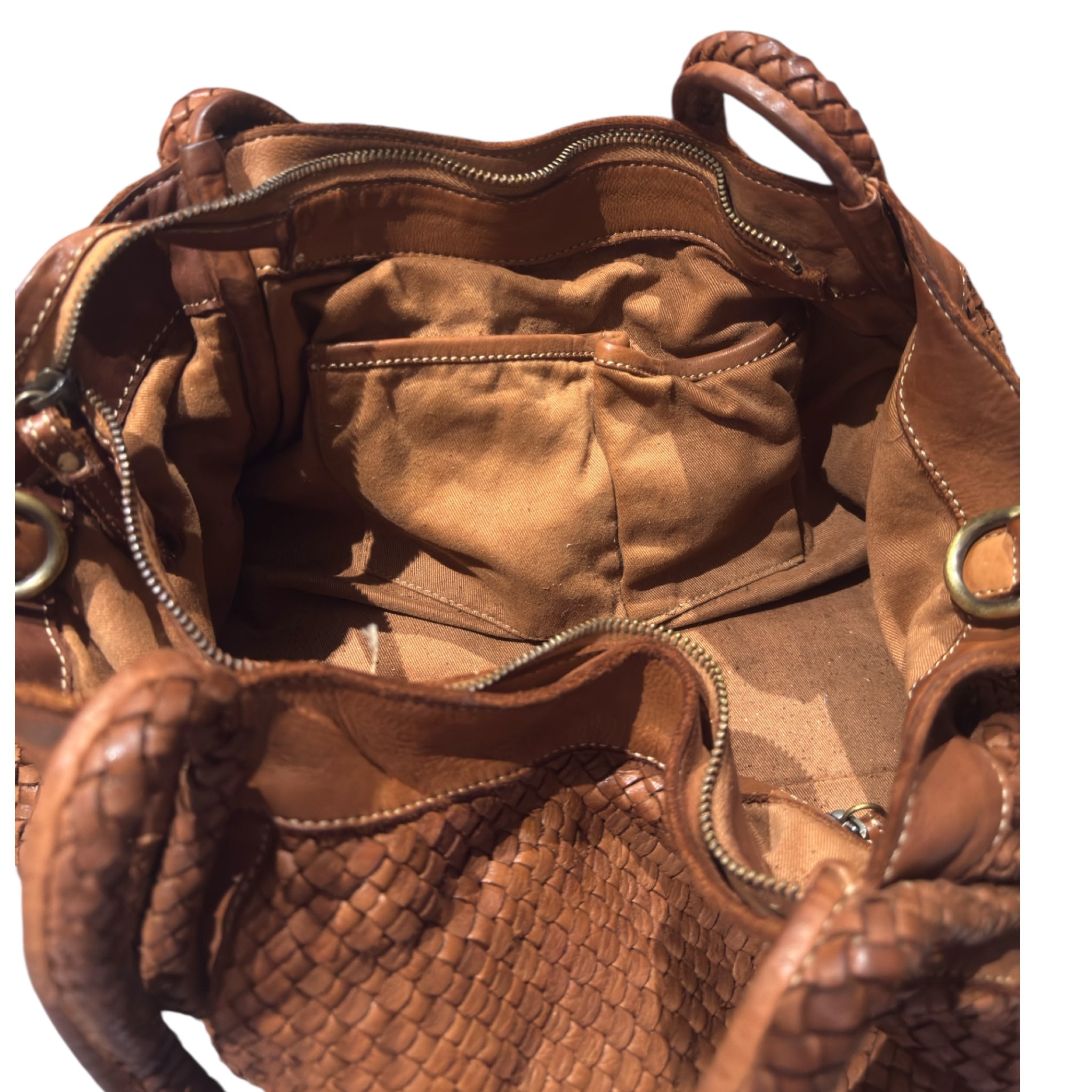 Showing inside pockets of an Italian leather tote handbag woven colour tan 