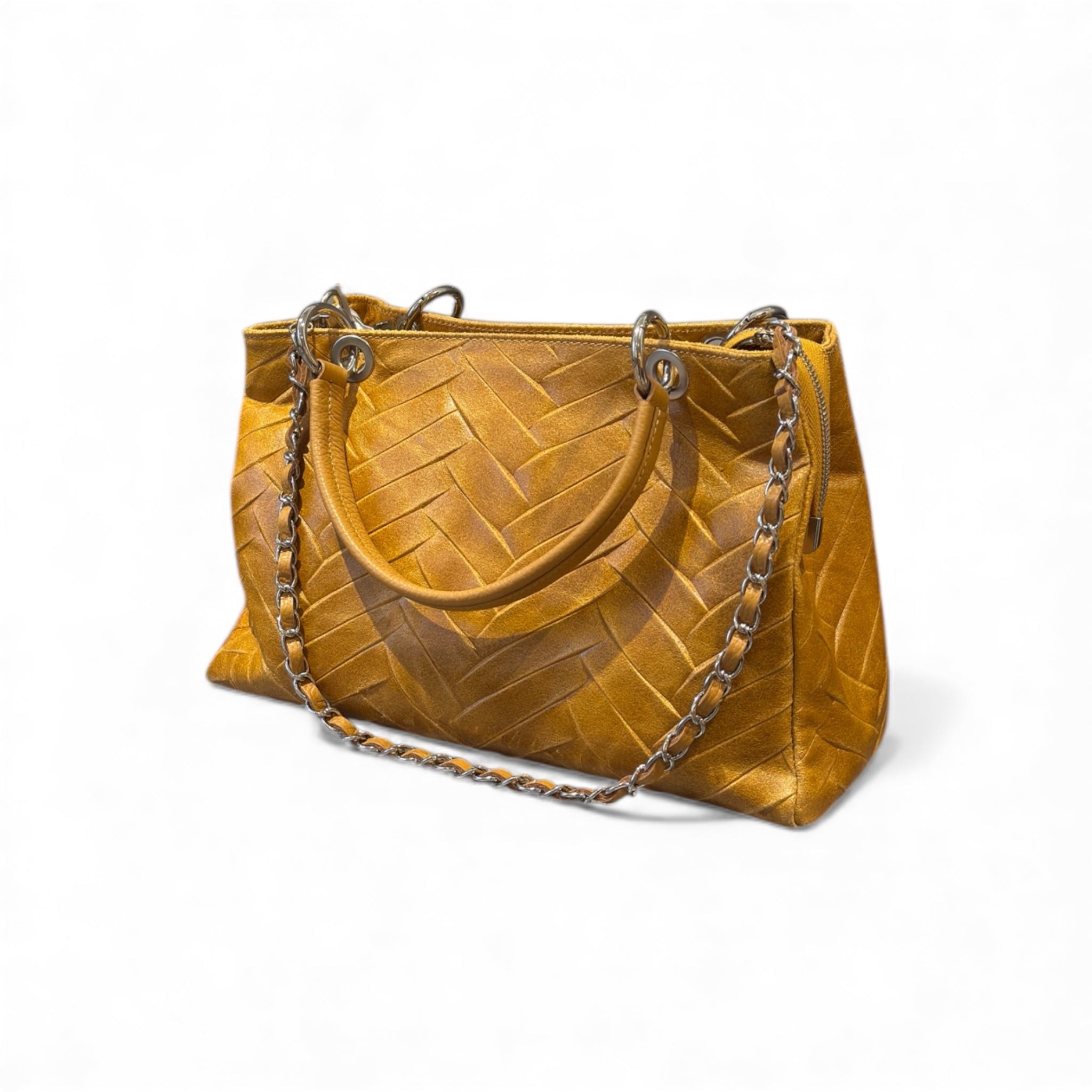 Yellow mustard tan Italian leather handbag with a chain strap on a white background