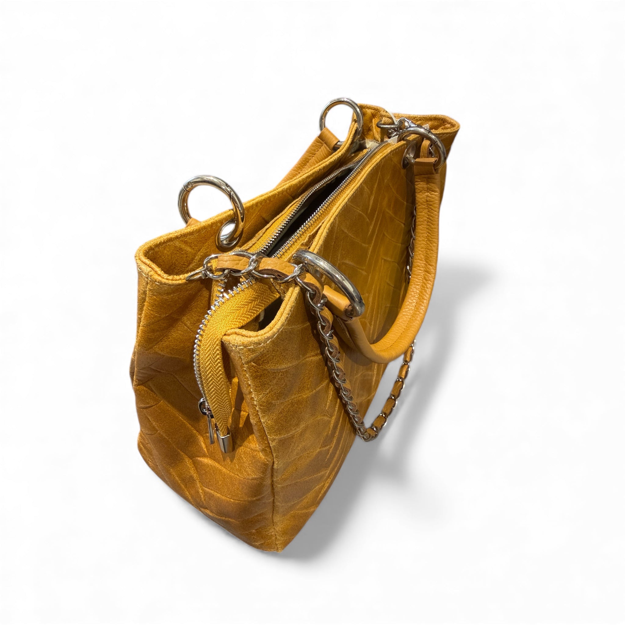Yellow tan mustard leather Italian handbag with chain detail on a white background