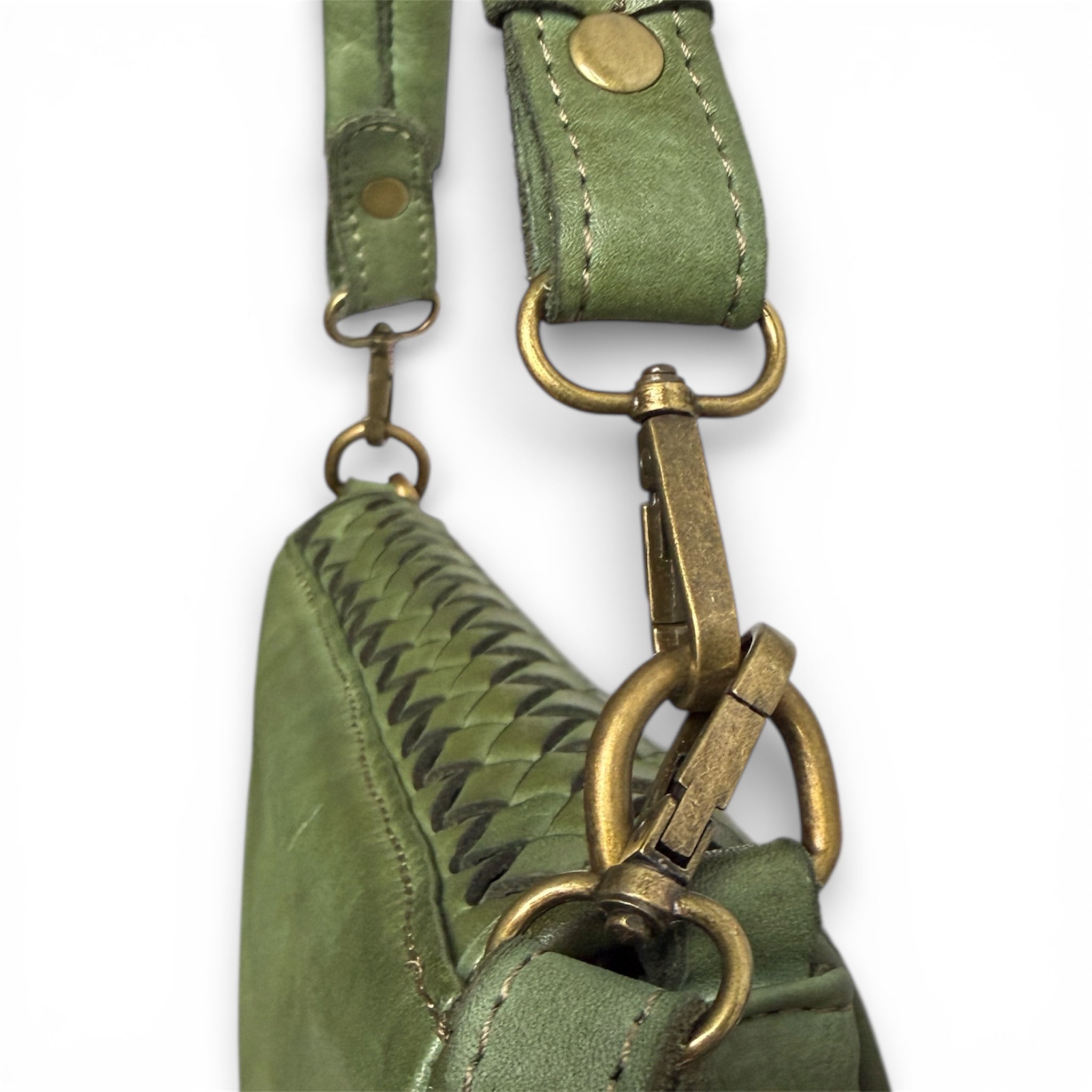 Close up of metal details of leather olive green handbag on a white background imported from Italy Florence 