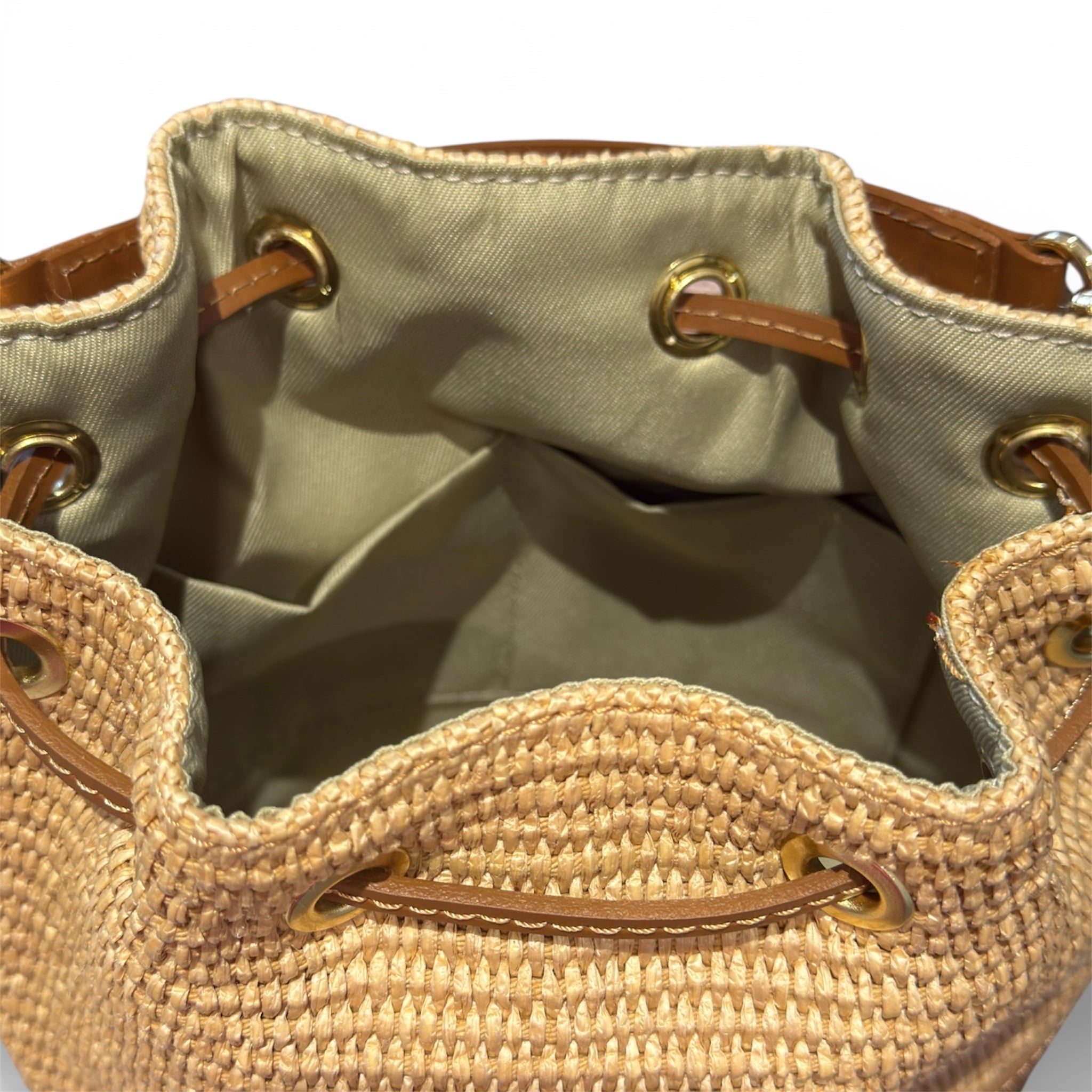 Inside of a raffia bucket leather bag U.K. independent handbag retailer 